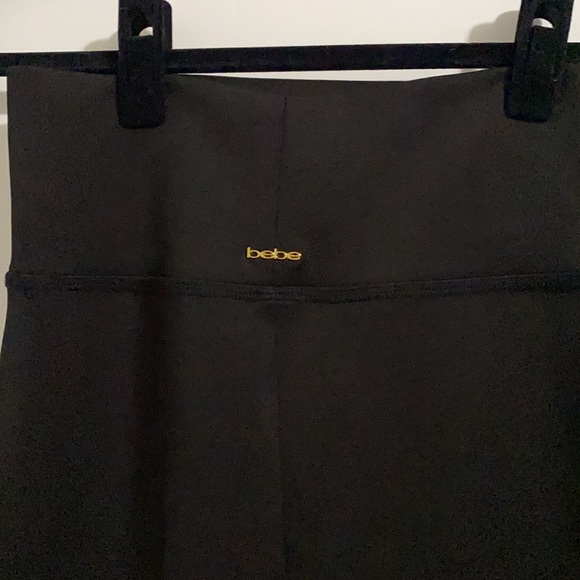 NWOT. Bebe black midi length skirt. Never worn. - Picture 5 of 6